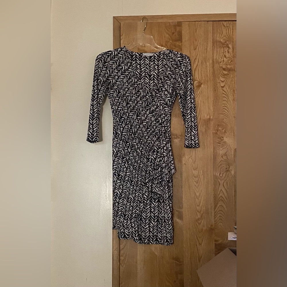 Black and white New York Company fitted stretch dress with ruched waist.…